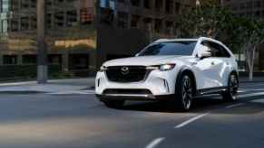 2024 Mazda CX-90 driving in a city