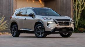 The 2025 Nissan Rogue near a home