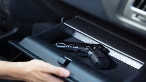 Gun in open car glovebox